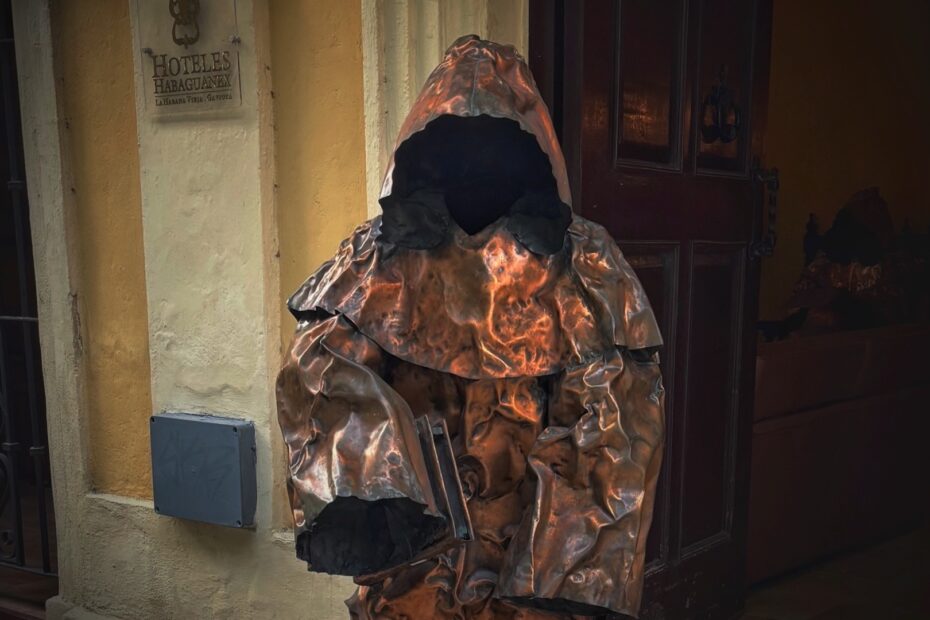 Bronze hooded monk sculpture in Havana illustrating horror movie classics and their biblical themes