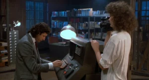 Seth Brundle and Veronica Quaife at the computer controlling the telepods in The Fly (1986)